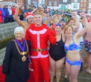 Mayor with group of swimmers